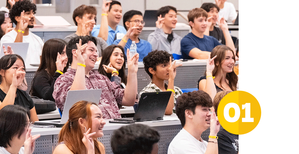diverse group of excited new students making zot signs