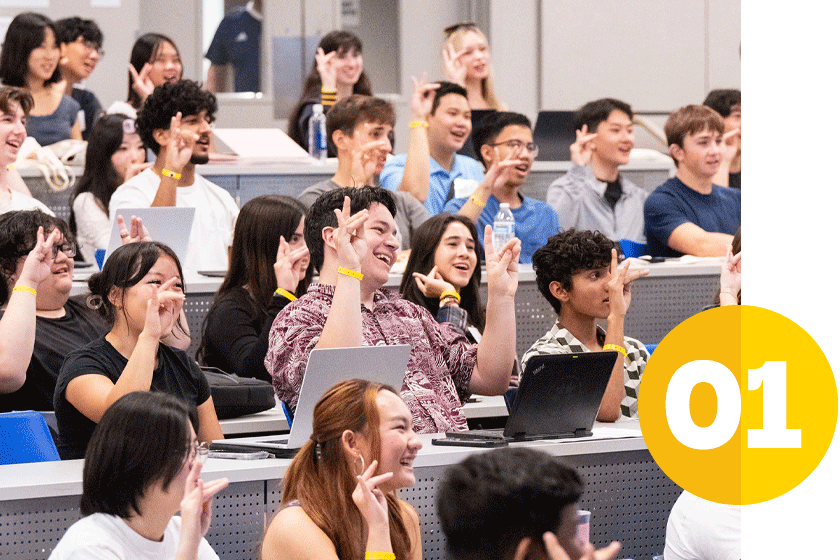 diverse group of excited new students making zot signs