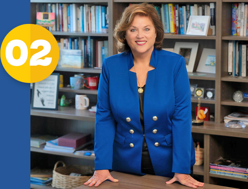Dean of school of public health Bernadette Boden-Albala standing in her study