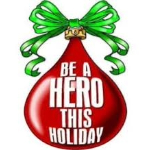 Droplet of blood that resembles a red ornament with a green bow that says "Be a hero this holiday."