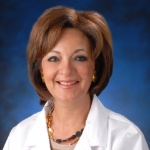 Headshot of Dr. Shahira Khoury in white coat.
