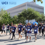 Crowd of people walking for the UCI Anti-Cancer Challenge.