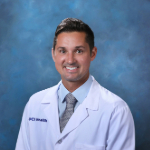 Headshot of Dr. Ryan DiGiovanni in white coat.