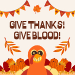 Text says: Give thanks! Give blood! Image of a smiling turkey with an assortment of fall decor.